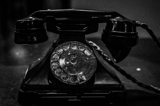 istock Vintage Rotary Dial Telephone in Black and White 2235355862