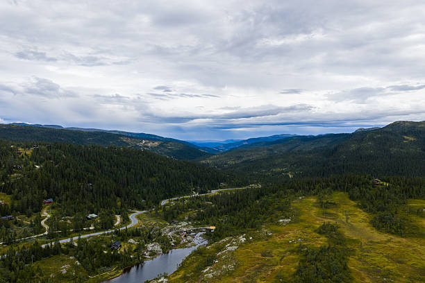 istock Winding road through a remote Norwegian valley landscape. 2235356335