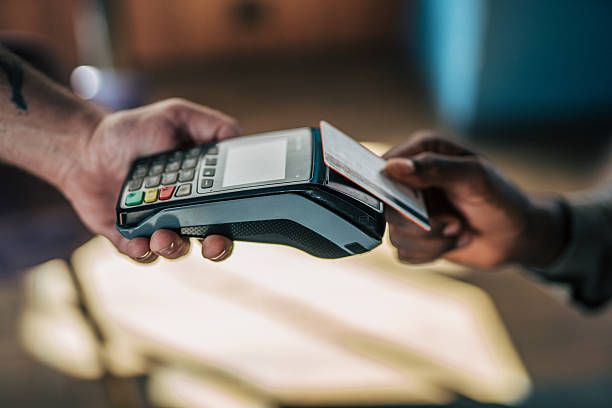 istock Customer paying with contactless credit card at pos terminal 2235356446