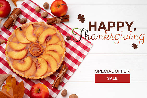 istock Thanksgiving celebration with apple pie and seasonal decorations on red checkered tablecloth 2235356867
