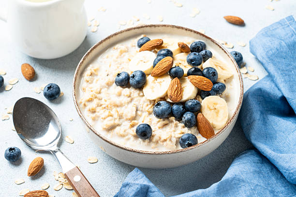 istock Oatmeal porridge with bananas, nuts and blueberries. 2235358557