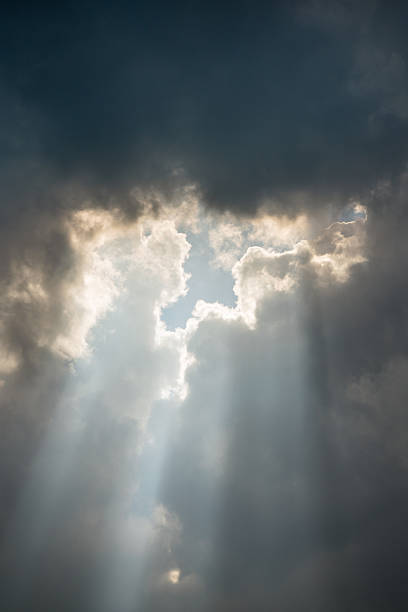 istock A bright ray of sunshine breaks through dark thunderclouds 2235360419
