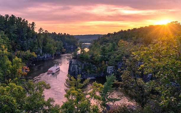 istock Paddle Wheel Boat cruising down the St Croix River at sunset 2235366539