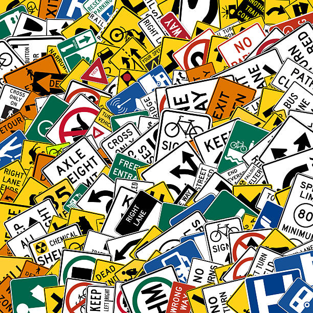 istock background of US standard road signs randomly scattered in various sizes and shapes for road education or driving school concept 2235366690