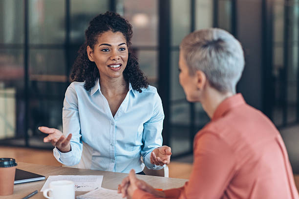 istock Two business person talking discussing important topics in the office 2235370119