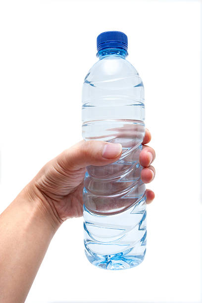 istock Holding water bottle isolated on white background 2235375760