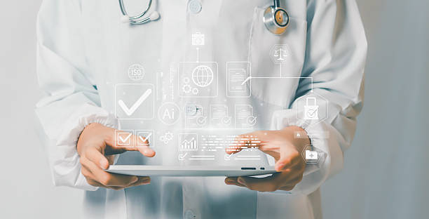 istock Concept of Digital Compliance & Quality showing doctor using tablet with glowing checklist icons, ISO symbols, secure approval workflow, representing healthcare standards, audit assurance, efficiency. 2235376184