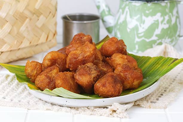 istock Getuk Goreng Fried Cassava Snack with Tea on White Table 2235376451