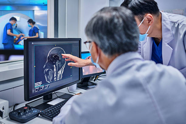 istock Two Asian Doctor Checking while Discussing at MRI-scanner Control Room 2235376846