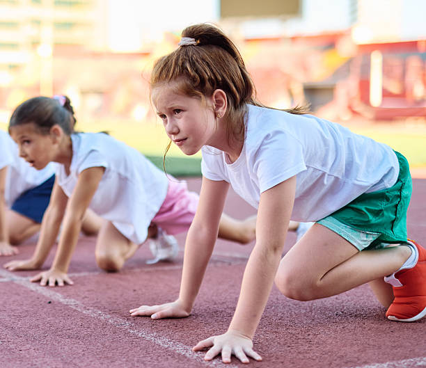 istock child sport athlete competition running exercise sprinting line start race runner preparation success concentration starting sprinter competitive finish winner 2235378743