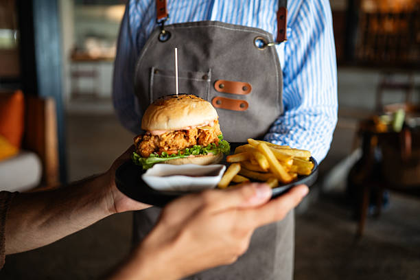 istock Restaurant marketing moment, a fresh burger and fries served with a smile creates visual content 2235381452