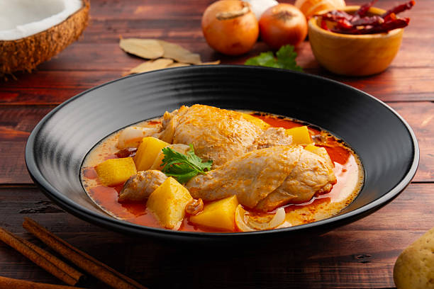 Massaman Curry with Chicken and Potatoes.It is an aromatic curry with a tangy, luxurious taste that is harmonic, sweet and isn't as spicy.