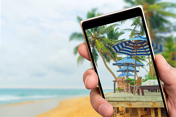 istock Summer cafe by ocean on smartphone screen. 2235387592