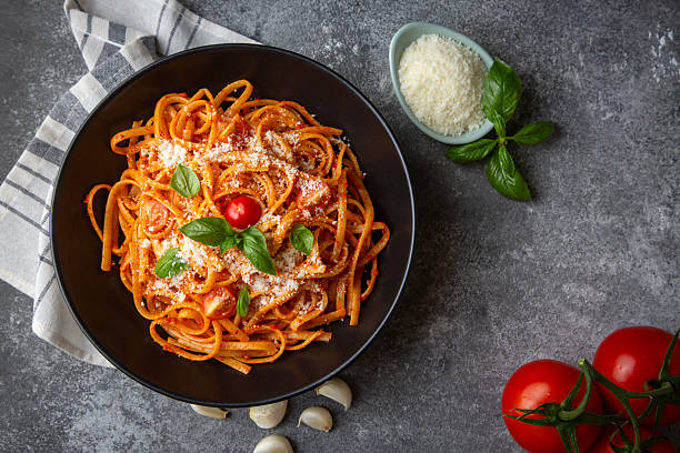 istock Flat spaghetti pasta with delicious tomato sauce and parmesan cheese. 2235389230