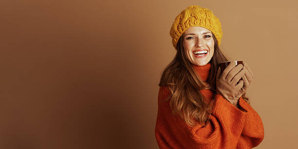 istock Smiling Woman in Beret with Warm Autumn Beverage 2235391497