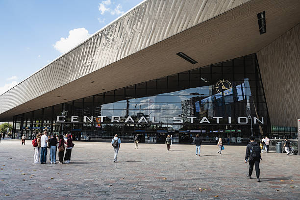 Rotterdam, Netherlands - September 1, 2025: Pedestrians walk outside Rotterdam Central Station. The current station building was officially opened in March 2014.