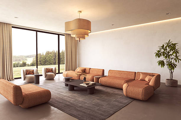 istock Spacious modern lounge with orange sofas and large windows 2235400692