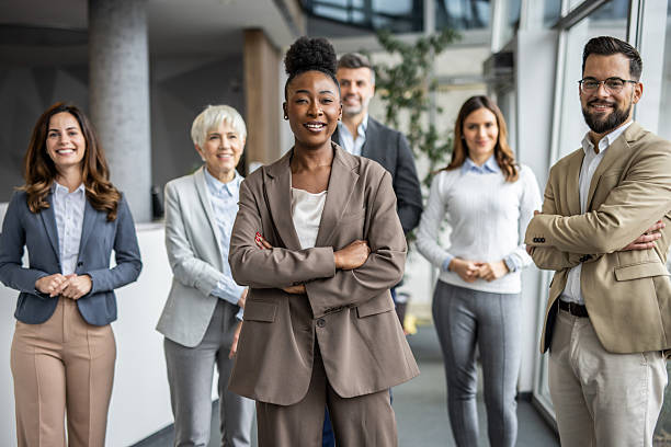 istock Diverse business team smiling with confidence in modern office 2235400803