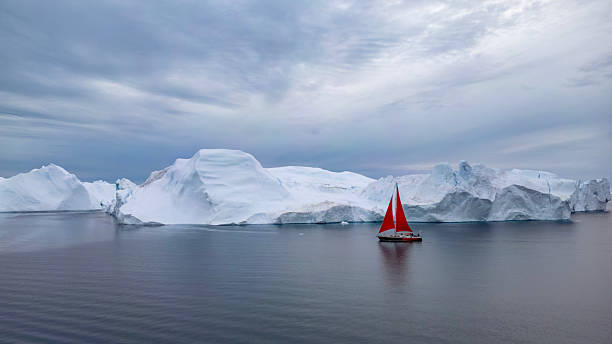 istock Red Sail in the Glacier's Shadow 2235403319