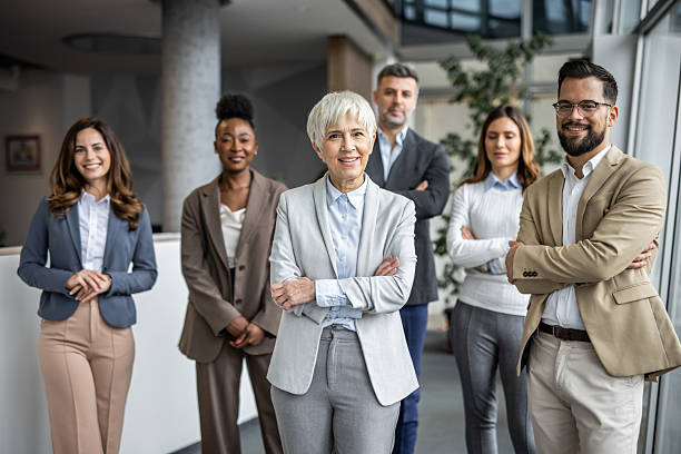 istock Diverse business team smiling with confidence in modern office 2235403710