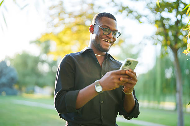 istock Happy Entrepreneur Using Mobile Phone in Park 2235403829