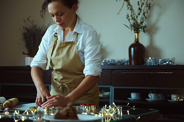 istock Woman Preparing Holiday Treats in Festive Kitchen Setting 2235404852