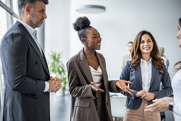 istock Diverse businesspeople talking during informal meeting in office 2235405313