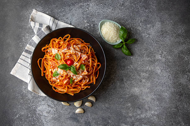 istock Flat spaghetti pasta with delicious tomato sauce and parmesan cheese. 2235405346