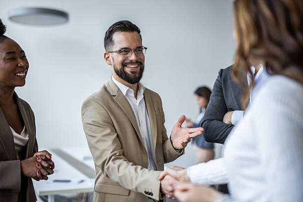 istock Businessman shaking hands with partner at office meeting 2235405463