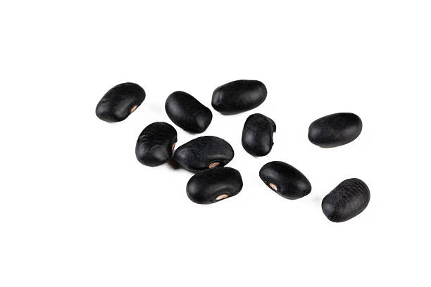 istock Dried black bean on the white background 2235406281