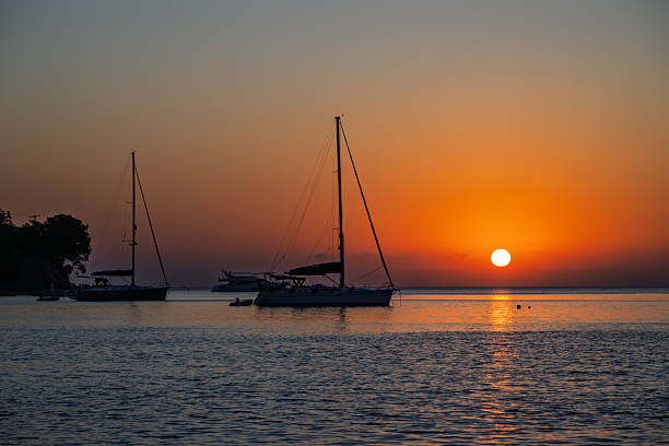 boats at the port in backlight on a  next to  sunset sky