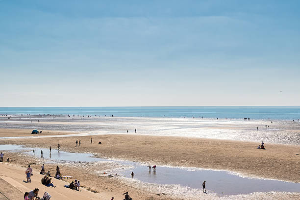 istock Crowded Beach with People, Sand, and Water in Blackpool, UK. 2235407512
