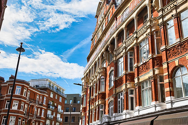 istock Red brick building with decorative stonework and arched windows  in London, UK. 2235408305