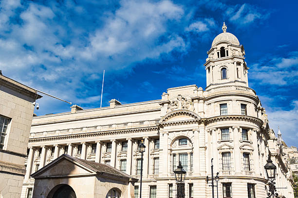 istock Ornate Building with Domed Tower Under Blue Sky  in London, UK. 2235408432