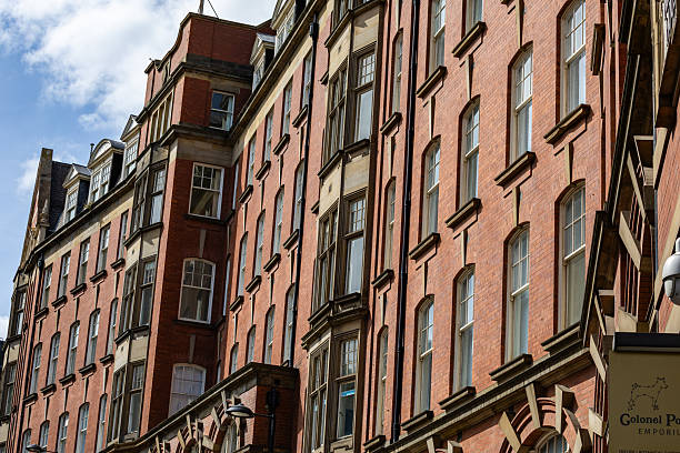 istock Red brick building with numerous windows and blue sky  in Newcastle upon Tyne, UK. 2235409289