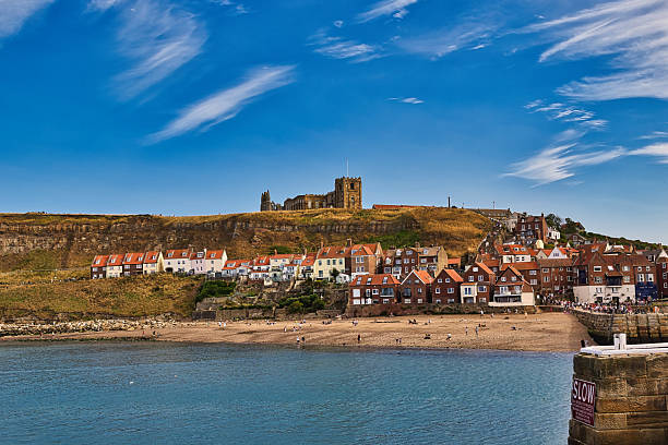 istock Coastal Town with Cliffside Buildings and Beach  in Whitby, UK. 2235409627