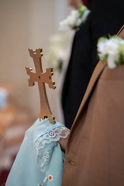 istock Priest holding cross during wedding ceremony. 2235414077