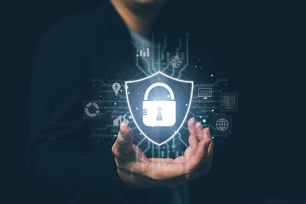 istock Cybersecurity concept with a businessman holding a shield lock icon, symbolizing data protection, network security, privacy, firewall, online safety, and digital information security technology. 2235414249