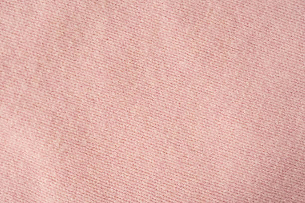 Soft pink cashmere sweater texture background.