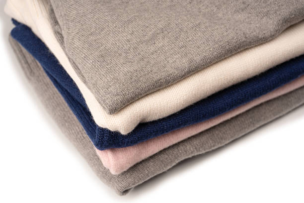 istock A group of warm sweaters isolated on a white background. 2235414487