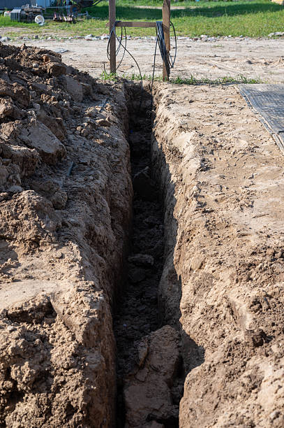 istock Construction trench prepared for utility installation at building site. 2235414946