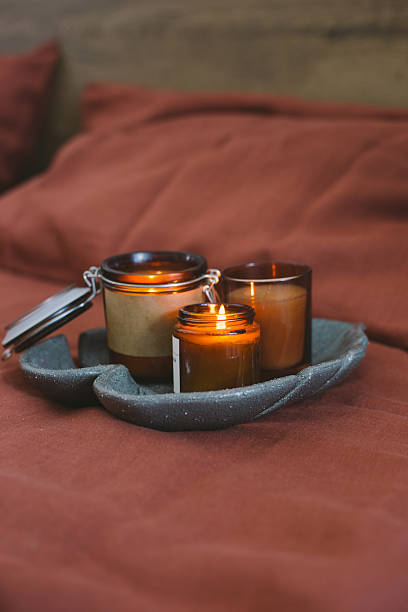 istock Aromatic Candles on a Decorative Tray Indoors 2235417596