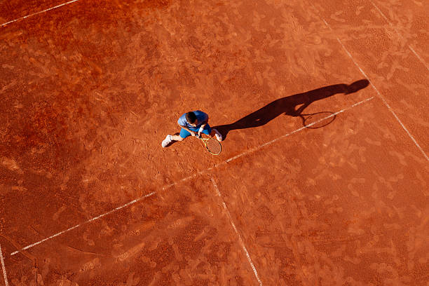 istock Overhead Drone Image of Tennis Player on Clay Surface 2235421029