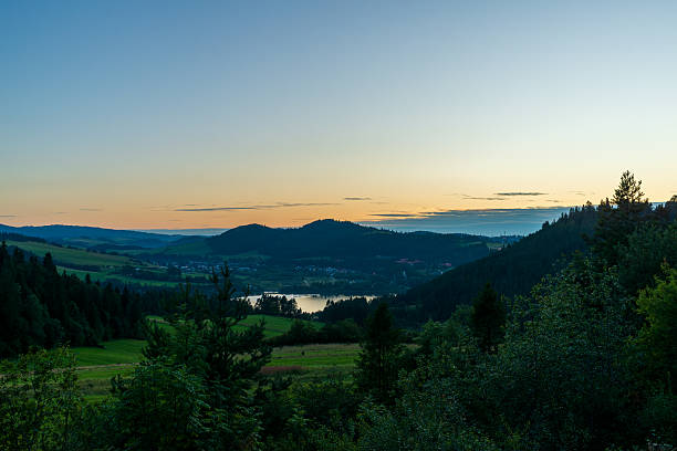 istock Scenic valley with hills at twilight 2235422543
