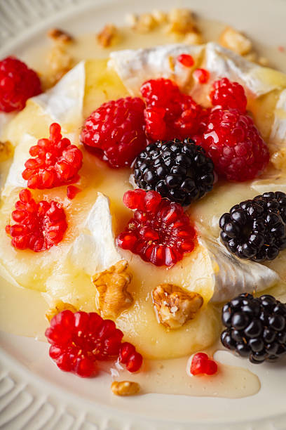 istock Grilled brie cheese with berries and honey 2235422646