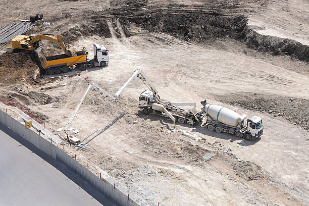 istock High-angle view of heavy machinery working at a construction site 2235427894