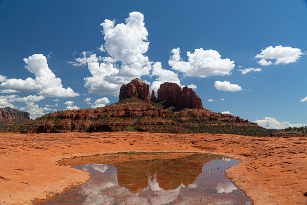 Scenic Sedona Arizona, landscape, Cathedral Rock vista with a reflection in a rain water pool.Natural beauty surrounds the Northern Arizona desert town of Sedona Arizona