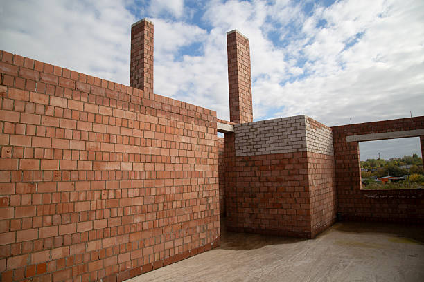Construction of a modern brick house. Finishing brick.