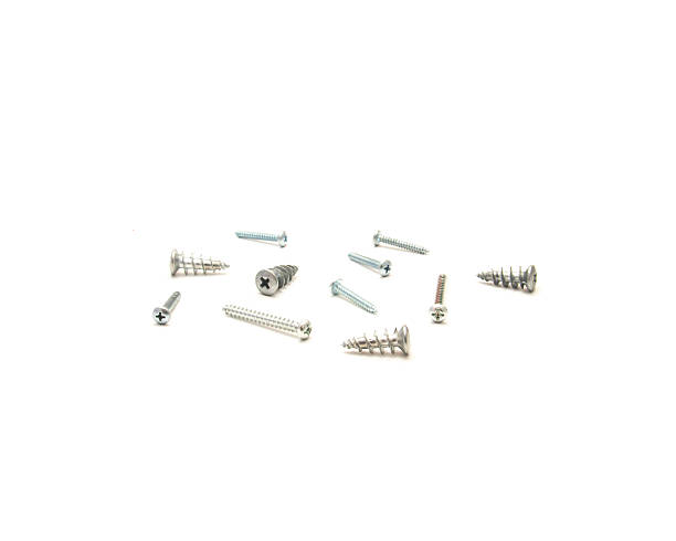 istock Mixed screws and wall anchors scattered isolated on white background. Includes flat-head, pan-head, and plastic anchors. Great for DIY kits, fastener variety packs, or home improvement visuals 2235433940