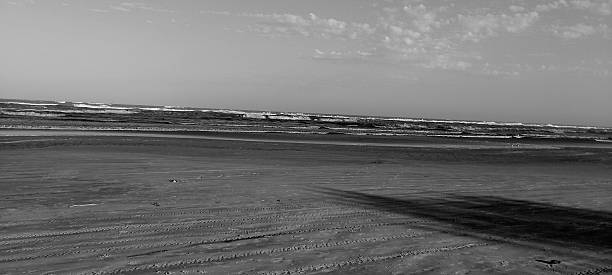 istock black and white beach photography 2235434149